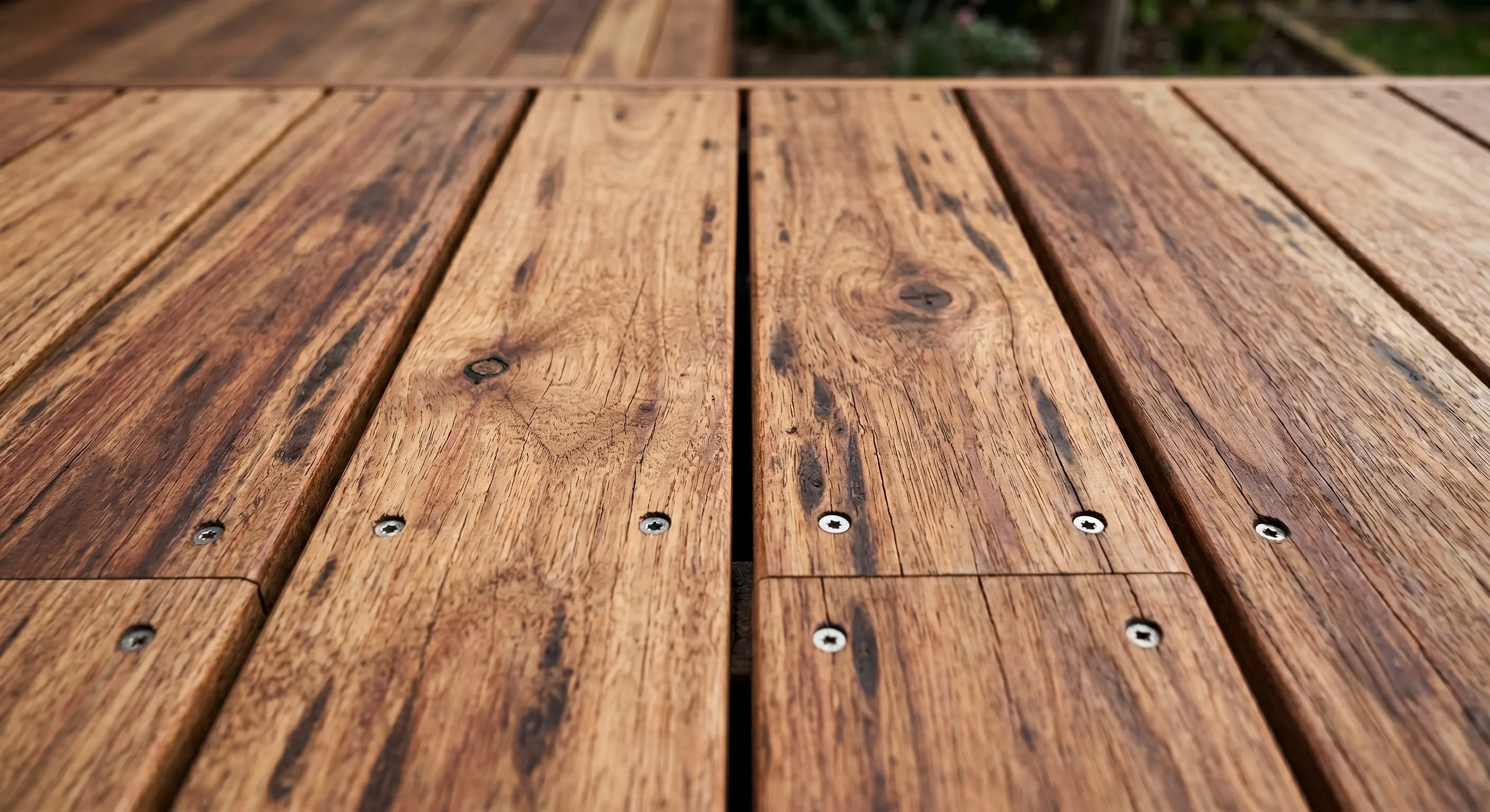 Close detail of a spotted gum deck showing clean board gaps and fixings