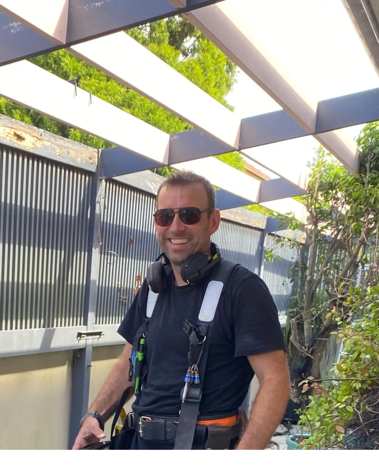 Dan Waring of Deck Hero, a Central Coast carpenter, in his tool belt on the job